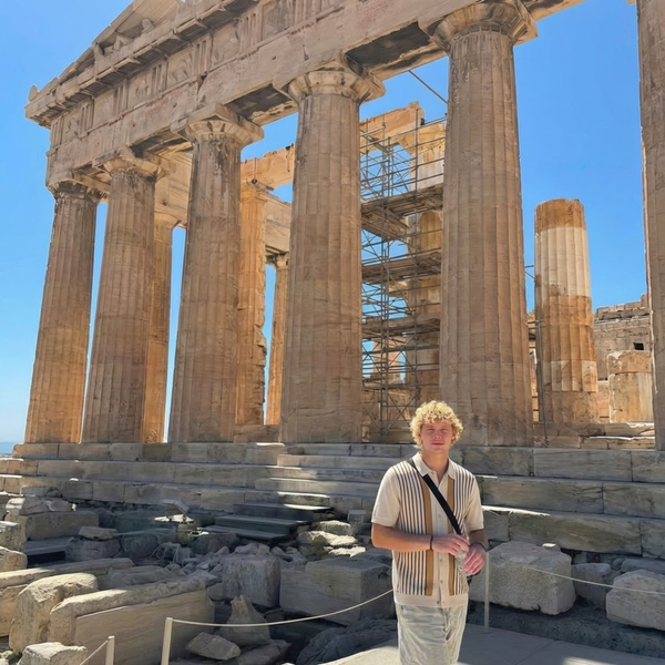 @anthonymerkis_ wearing the Camden knit polo shirt in Athens